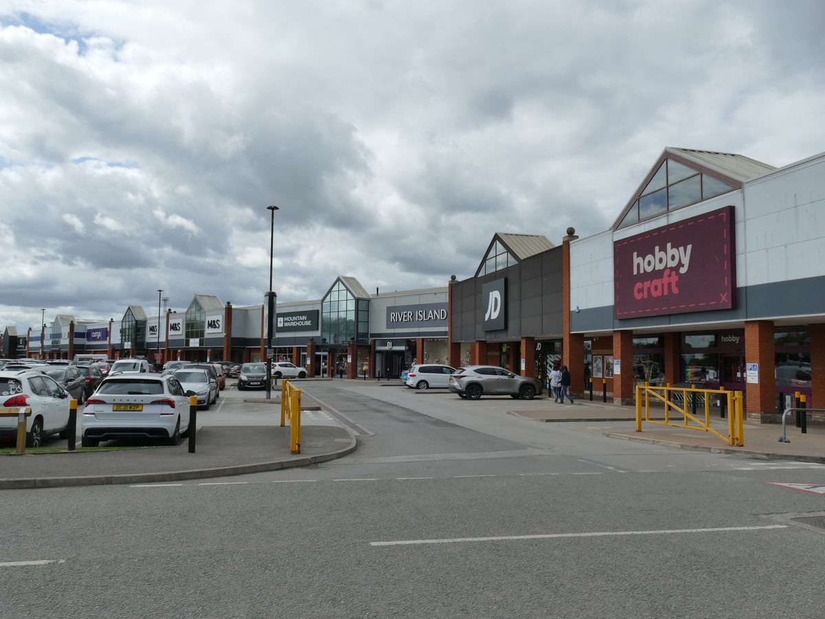 Grand Junction Retail Park in Crewe, with retail warehouse units and parking
