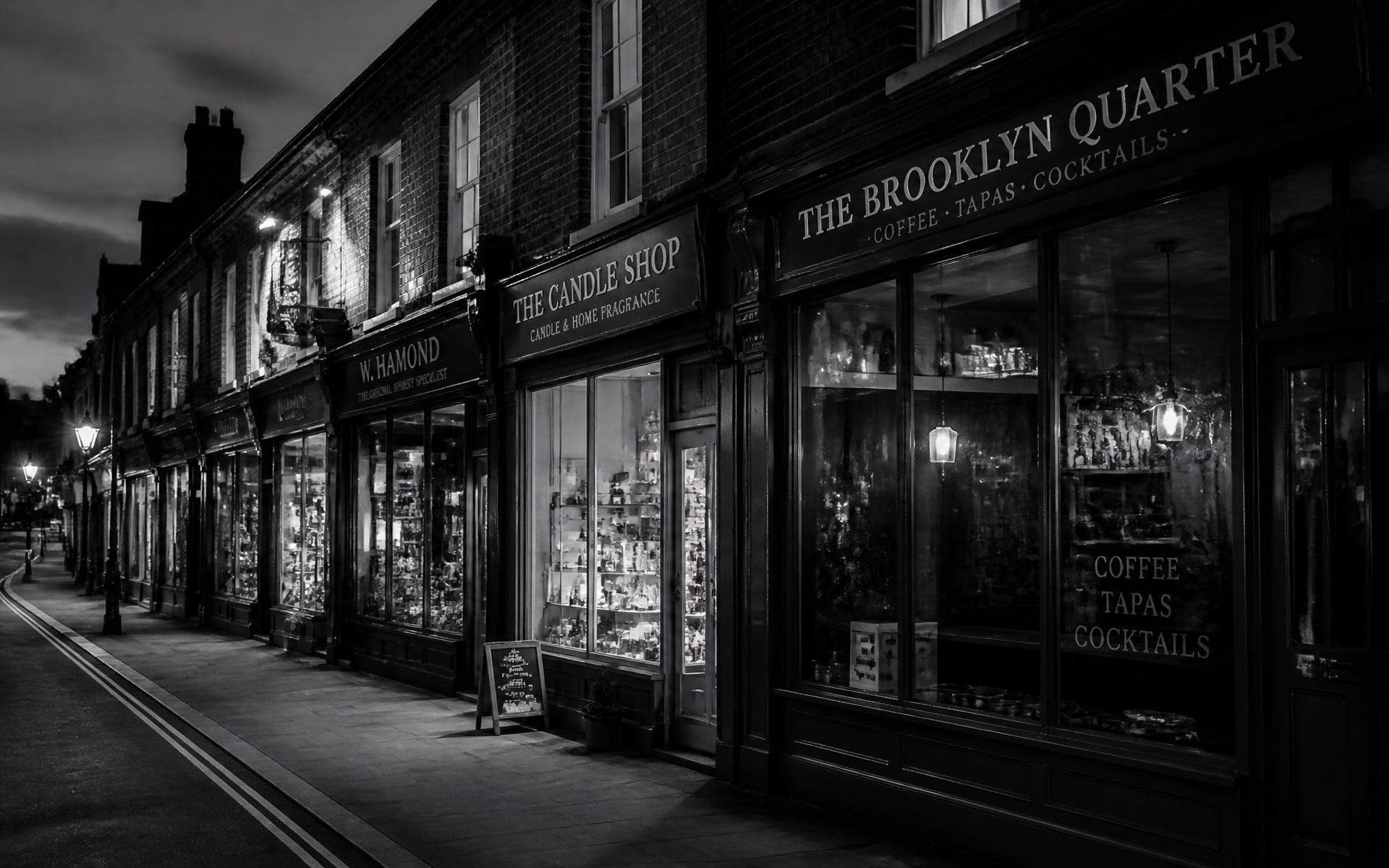 British high street shopfronts at dusk